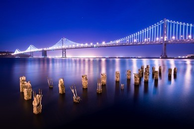 bay bridge between san francisco and treasure island at night.