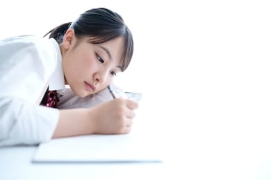 young asian student studying in room.