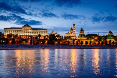 moscow kremlin and moscow river illuminated in the evening, russia