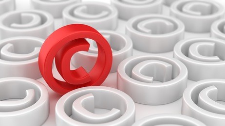 many white copyright symbols around red one