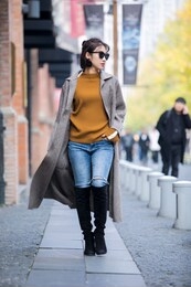 asian fashion girl in trench coat on the street