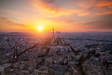 aerial view, from montparnasse tower at sunset and night sky, view of the eiffel tower and la defense district in paris, france