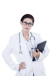 confident female doctor and touchpad on white background
