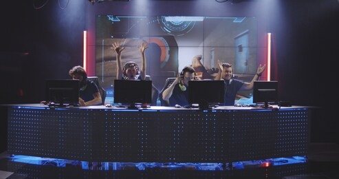 full shot of a team winning a match at a gaming tournament