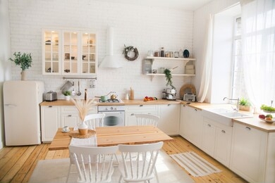 
interior of modern sunny kitchen in a scandinavian-style apartment. kitchen furniture, dishes, spices
