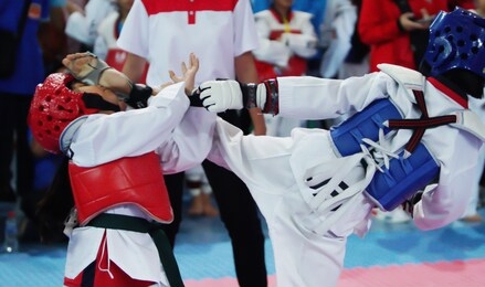 blue guard taekwondo kick to face of kid red protective gear, best moment of fighting in championship international competition