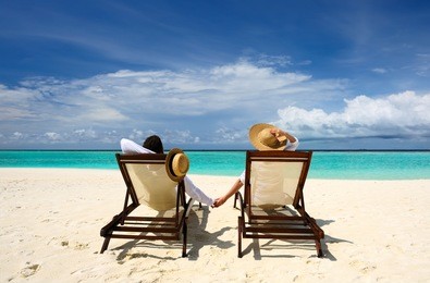 couple on a tropical beach at maldives