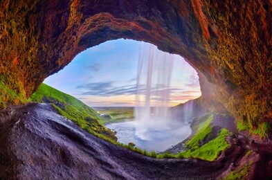 incredible sunset on seljalandsfoss. one of the most beautiful waterfalls on the iceland, europe. popular and famous tourist attraction summer holiday destination in on south iceland. travel postcard