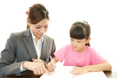 teacher with girl studying.