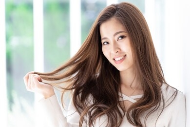 portrait of attractive asian woman hair care image