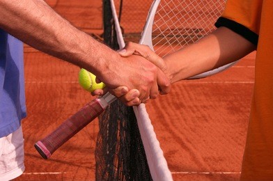 shaking hands after tennis match