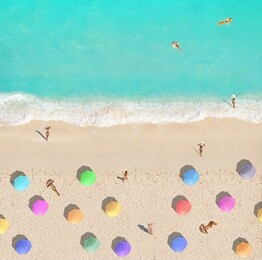 beach from above umbrellas people swimming sunbath