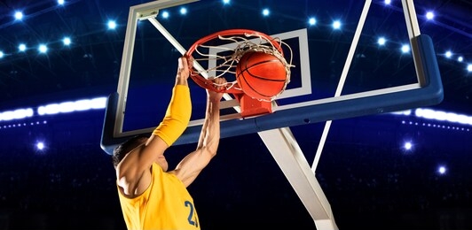 dunk. basketball man player. yellow uniform. number 23
