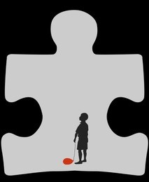 autism cave. silhouette of autistic child with a deflated red air balloon, standing in a cave in a shape of a symbol for autism 