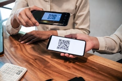 qr code payment. woman scanning qr code online shopping cashless technology concept