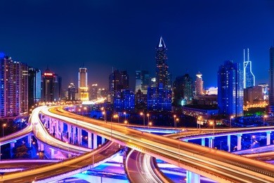 modern city skyline with interchange overpass in shanghai at night,china