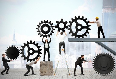 teamwork works together to build a gear system
