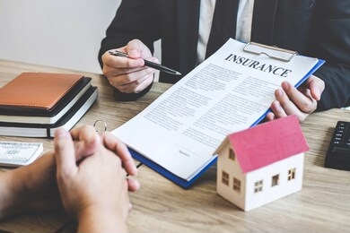 estate agent broker reach contract form to client signing agreement contract real estate with approved mortgage application form, buying or concerning mortgage loan offer for and house insurance.