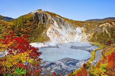 mt. hiyori rises above oyunuma lake in hell valley, noboribetsu, hokkaido, japan.