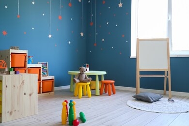 stylish interior of modern playroom in kindergarten
