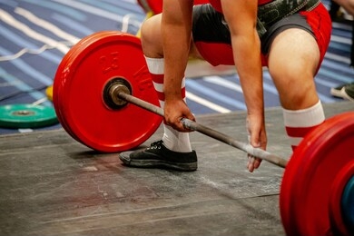 men powerlifter start attempt deadlift competition in powerlifting