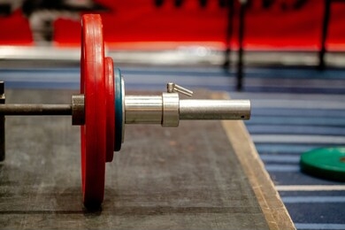 bar with plates on ground for deadlift competition