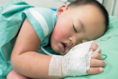 children sleep on the hospital bed with saline solution.
