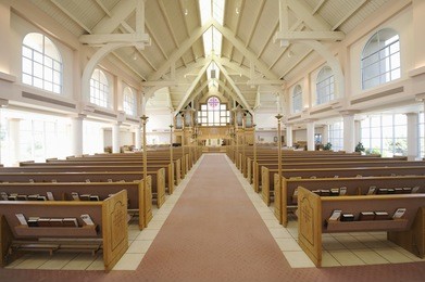 interior view of a modern church with empty pews