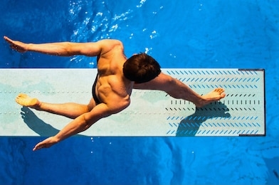 top view of diving man during exercise. diver from a unique perspective. the athlete is captured from the top camera view during practice.