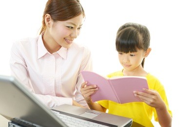teacher with girl studying.