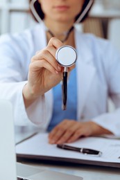 doctor with a stethoscope in the hands, close up. physician ready to examine and help patient. medicine, healthcare and help concept