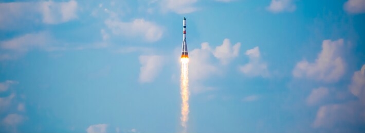 a real rocket in flight, a launch vehicle from a spaceport. take-off rocket in the sky against the background of clouds. launch concept, the power of science and technology. modern technology.