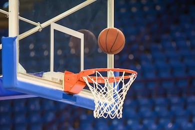 a basketball flying into the basket
