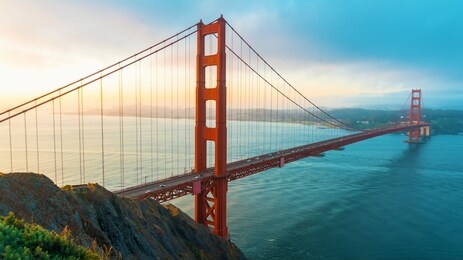 san francisco's golden gate bridge at sunrise from marin county