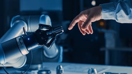 futuristic robot arm touches human hand in humanity and artificial intelligence unifying gesture. conscious technology meets humanity. concept inspired by michelangelo's creation of adam