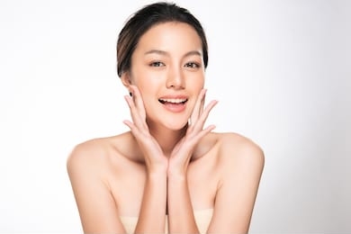 beautiful young asian woman with clean fresh skin touch own face, facial treatment, cosmetology, beauty and spa,