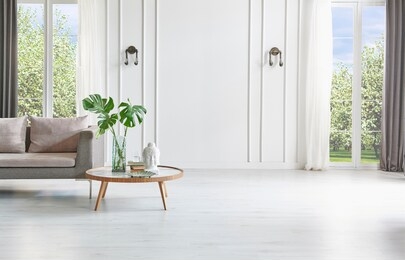 white living room with blue classic sofa, garden view, marble middle table and lamp interior.