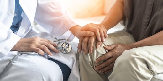 parkinson's disease patient, arthritis hand and knee pain or mental health care concept with geriatric doctor consulting examining elderly senior aged adult in medical exam clinic or hospital
