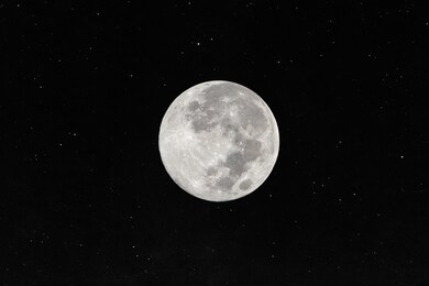 full moon with many stars in the dark night.
