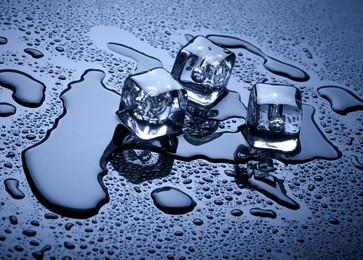 ice cubes over dark background