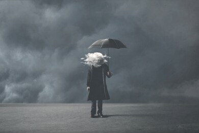 sad surreal man with cloud on his head