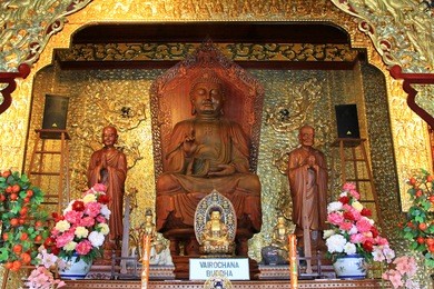 one of the buddhas, vairochana buddha at the buddhist temple of supreme bliss : kek lok si. one of popular tourist attractions in penang, malaysia