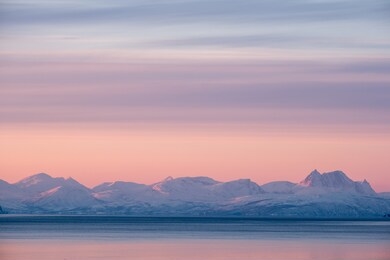 minimalistic artic landscape under pink sky at sunset, tromsö, norway