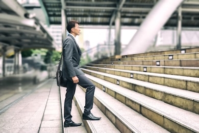 businessman step forward on the stair