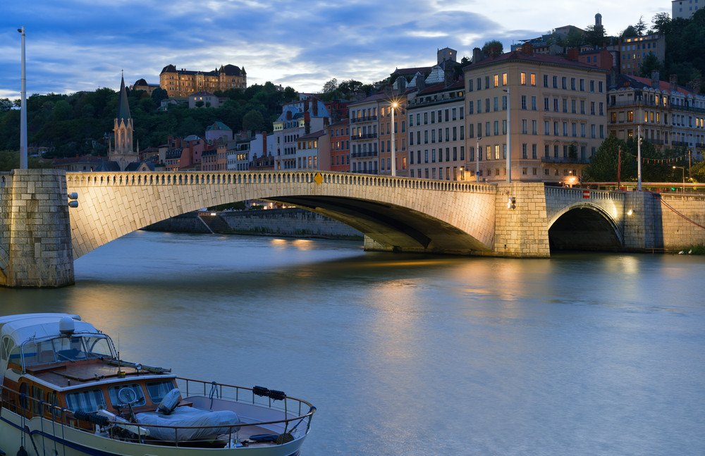 cityscape of lyon and saone river at night