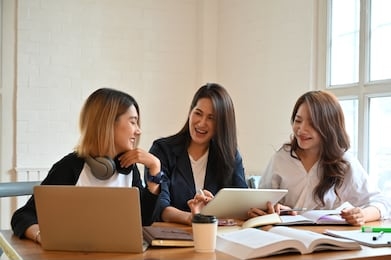 group of woman tutor in campus university room with young woman and 30s woman talking with education.