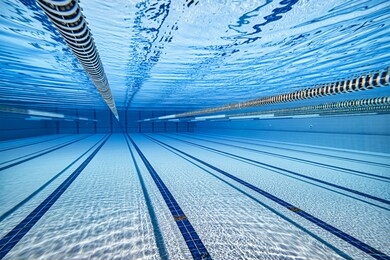 olympic swimming pool underwater background.