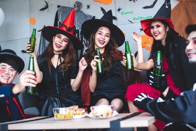 a group of asian men dressed in fantasy-themed halloween party to celebrate your average fun.
