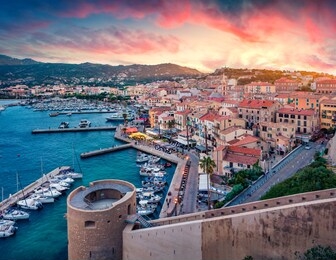 fantastic morning cityscape of calvi port. aerial summer sunrise on corsica island, france, europe. stunning seascape of mediterranean sea. traveling concept background.