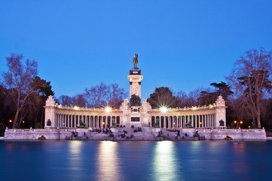 evening long exposure shot of the memorial in retiro city park, madrid, spain